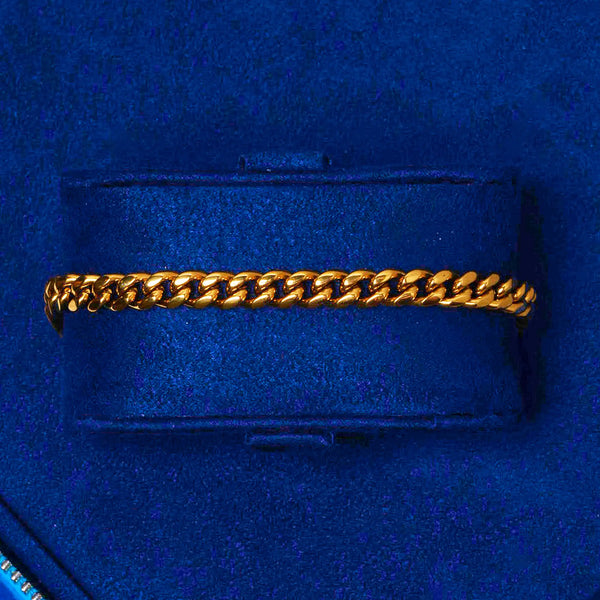 Micro Cuban Bracelet Gold 18K plated stainless steel chain on blue velvet display