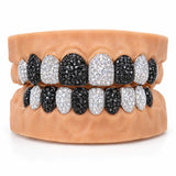 Moissanite grillz alternating black and white iced teeth across upper and lower sets, front view