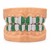 Silver moissanite grillz alternating green and white stone teeth in vertical stripes, front view