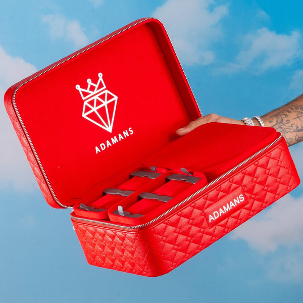 Red leather travel jewellery case with stackable trays by Adamans.