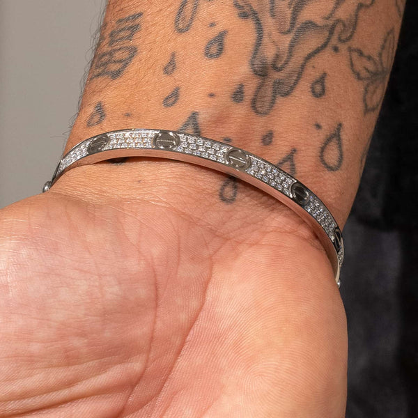Iced Band Bracelet in white gold with diamond accents worn on tattooed wrist